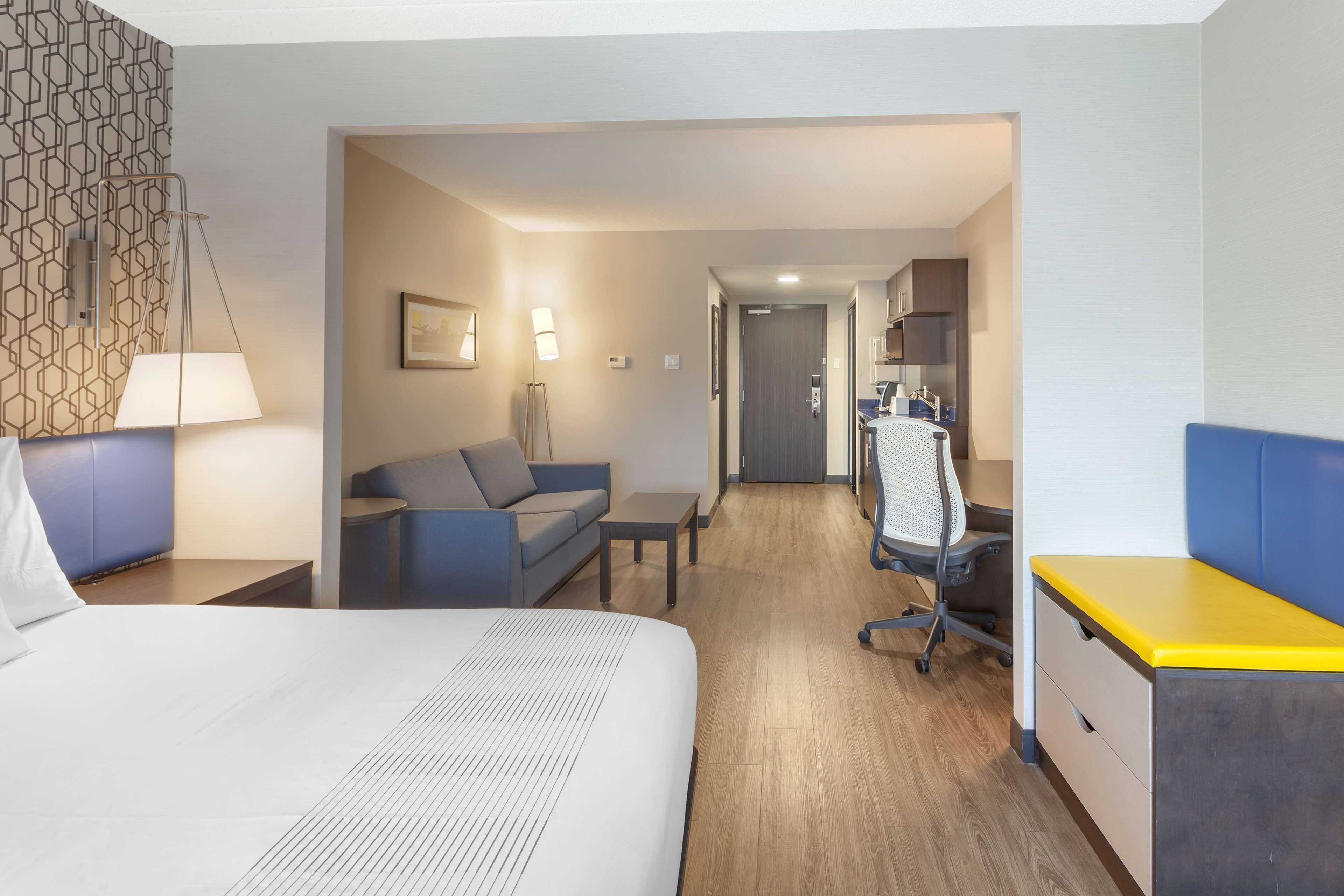 suite, 1 king bed, non smoking, kitchenette (walk-in shower;with sofabed) | in-room safe, desk, laptop workspace, iron/ironing board