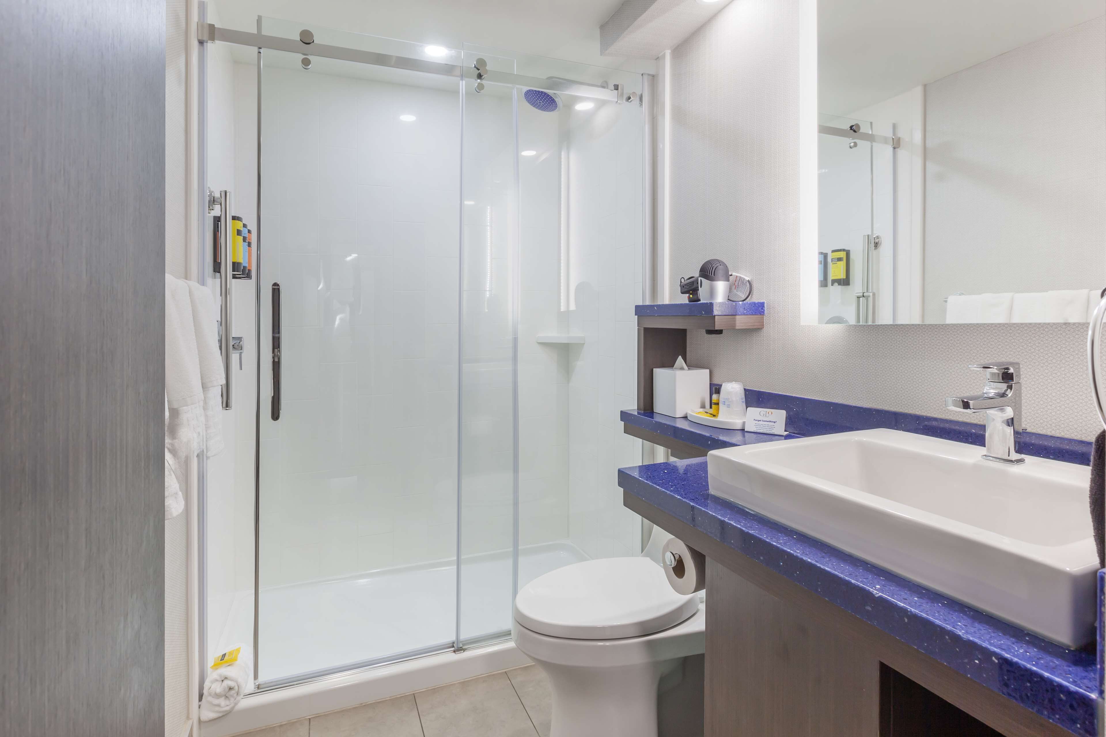 suite, 2 queen beds, non smoking, refrigerator & microwave (walk-in shower;with sofabed) | bathroom | shower, hair dryer, towels