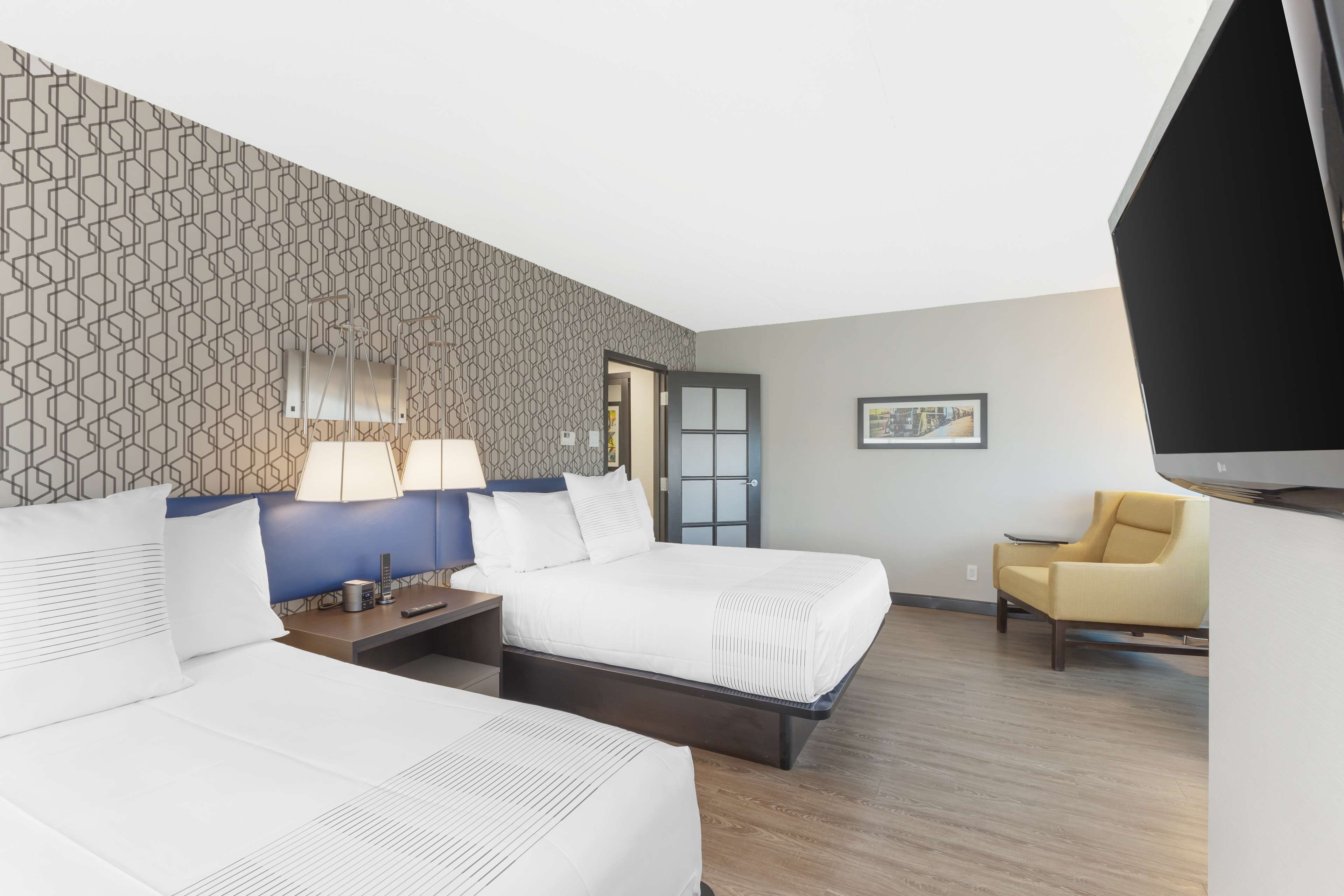 suite, 2 queen beds, non smoking, refrigerator & microwave (walk-in shower;with sofabed) | in-room safe, desk, laptop workspace, iron/ironing board