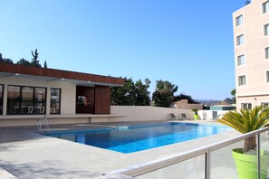 Outdoor pool, open 6:30 AM to 10:30 PM, pool loungers