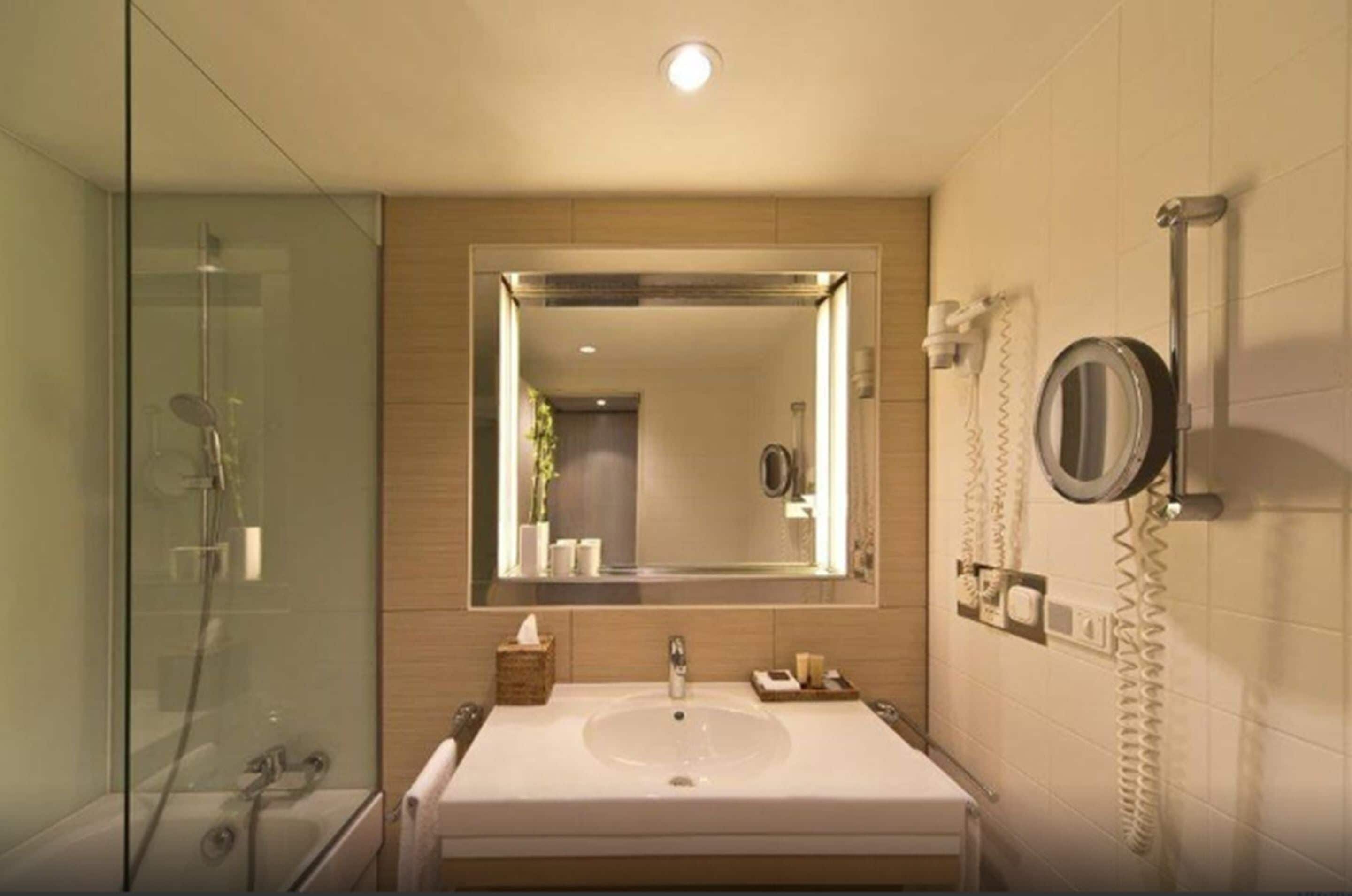 combined shower/bathtub, designer toiletries, hair dryer, bathrobes