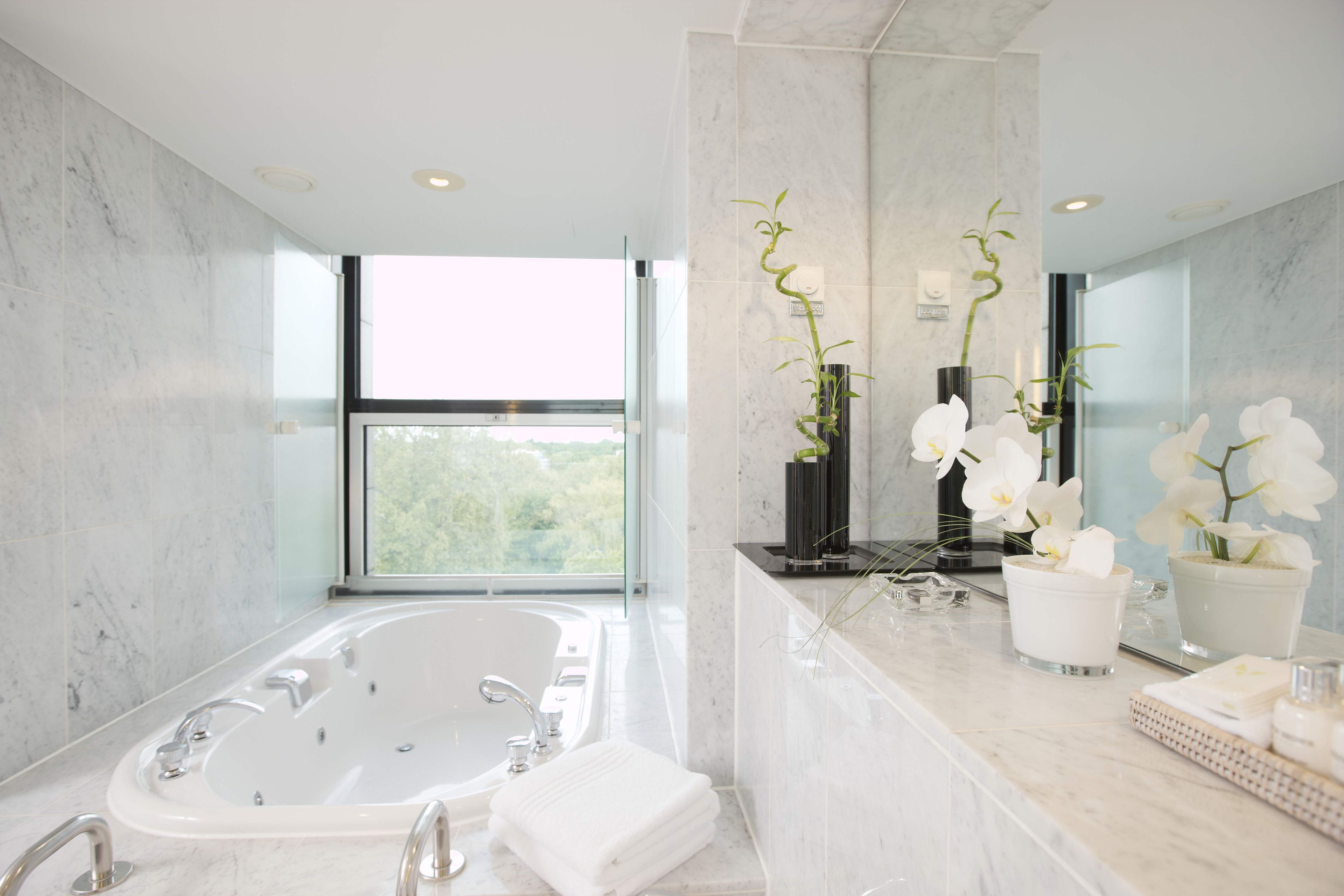 combined shower/bathtub, designer toiletries, hair dryer, bathrobes