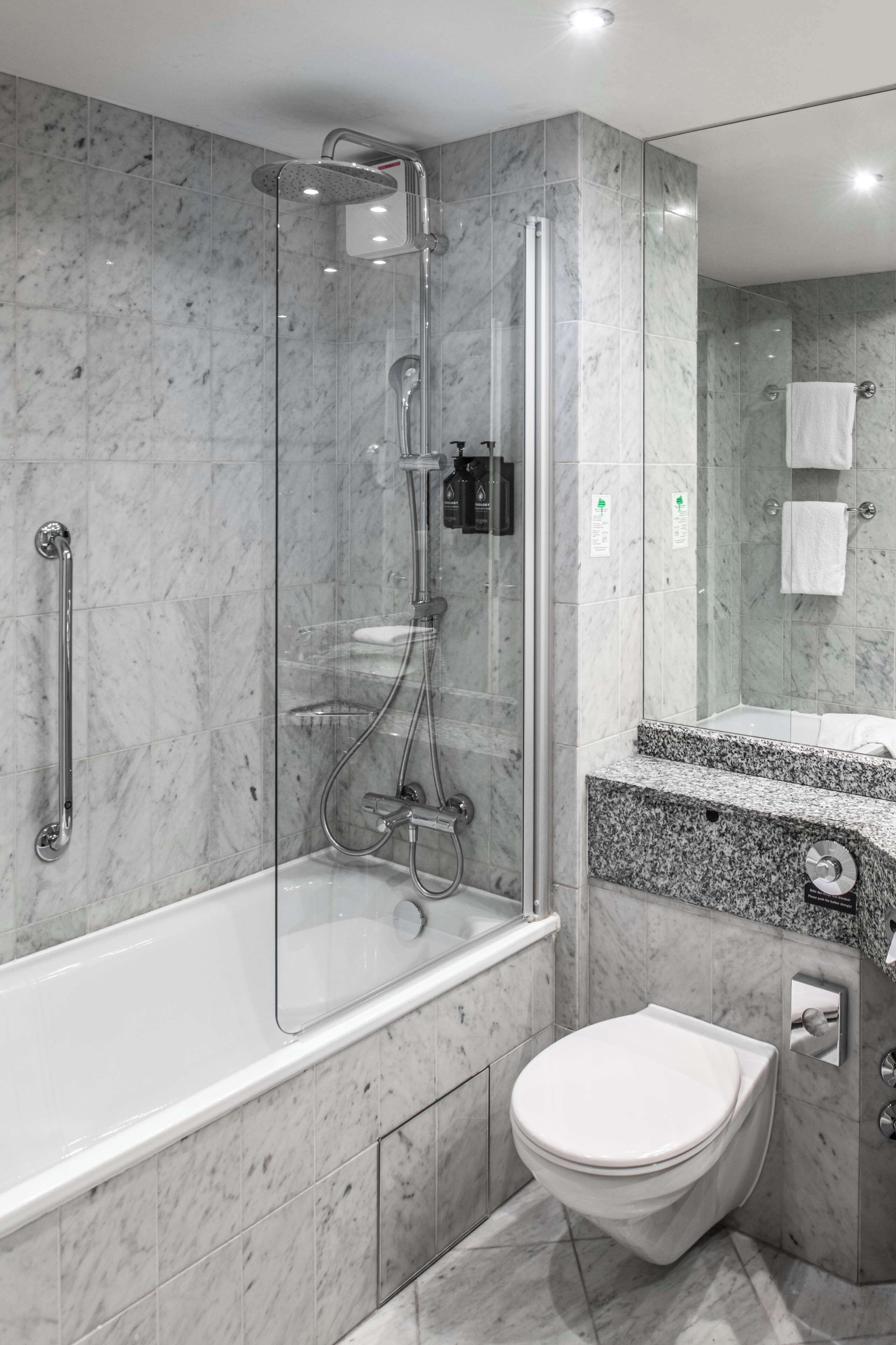 combined shower/bathtub, rainfall showerhead, eco-friendly toiletries