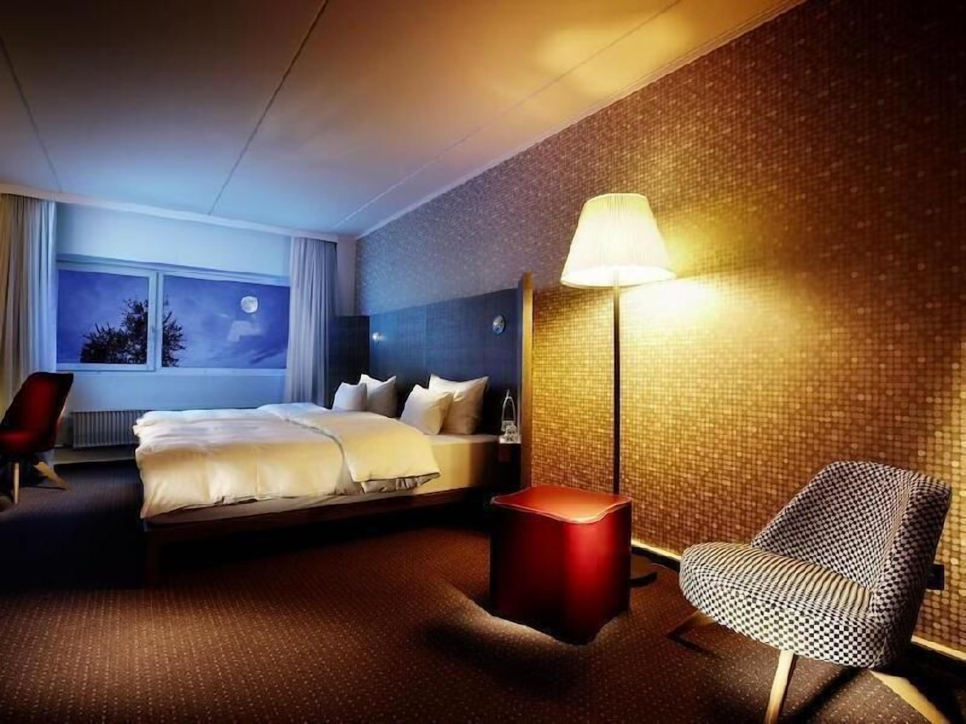 Hypo-allergenic bedding, desk, laptop workspace, blackout curtains