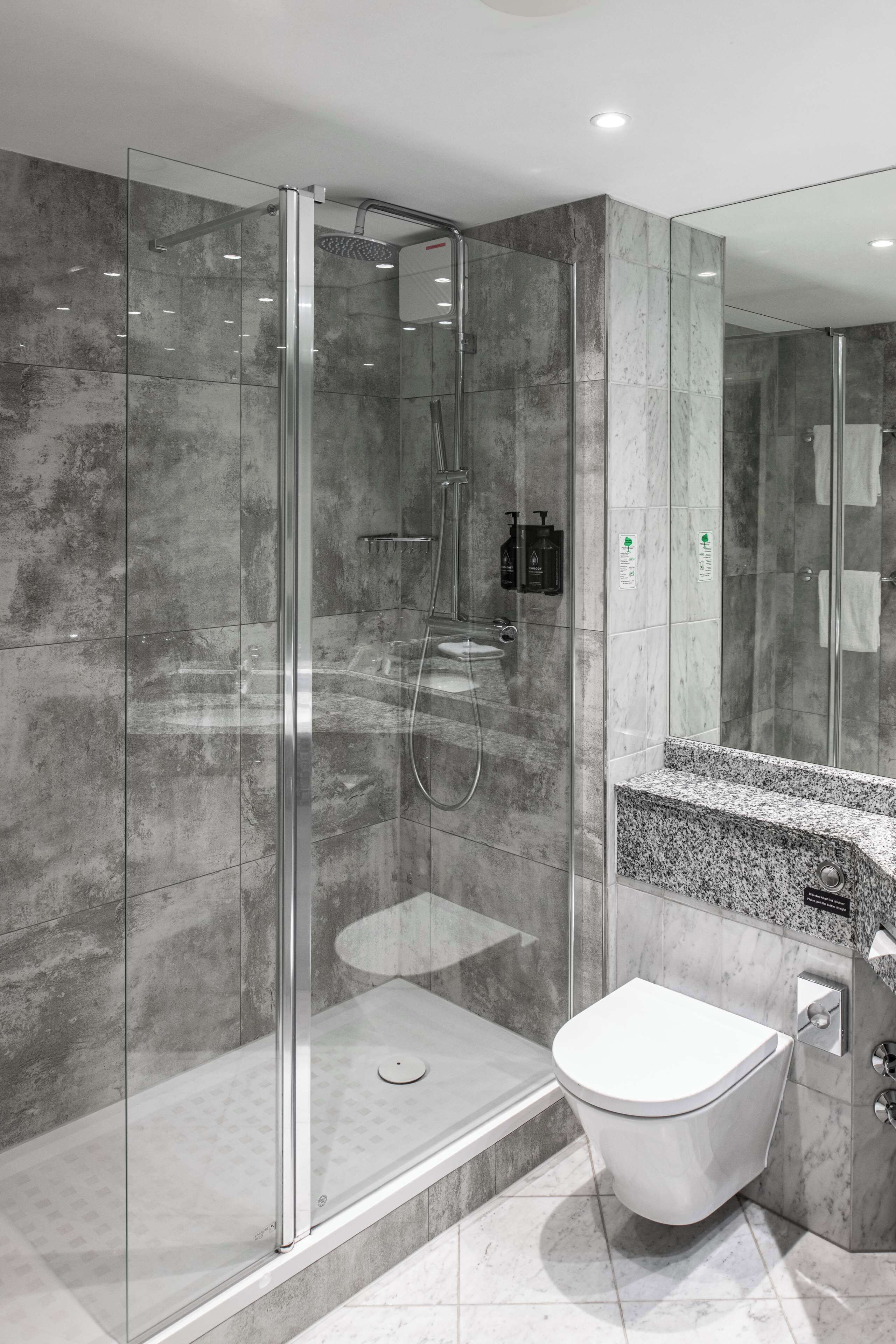 combined shower/bathtub, rainfall showerhead, eco-friendly toiletries