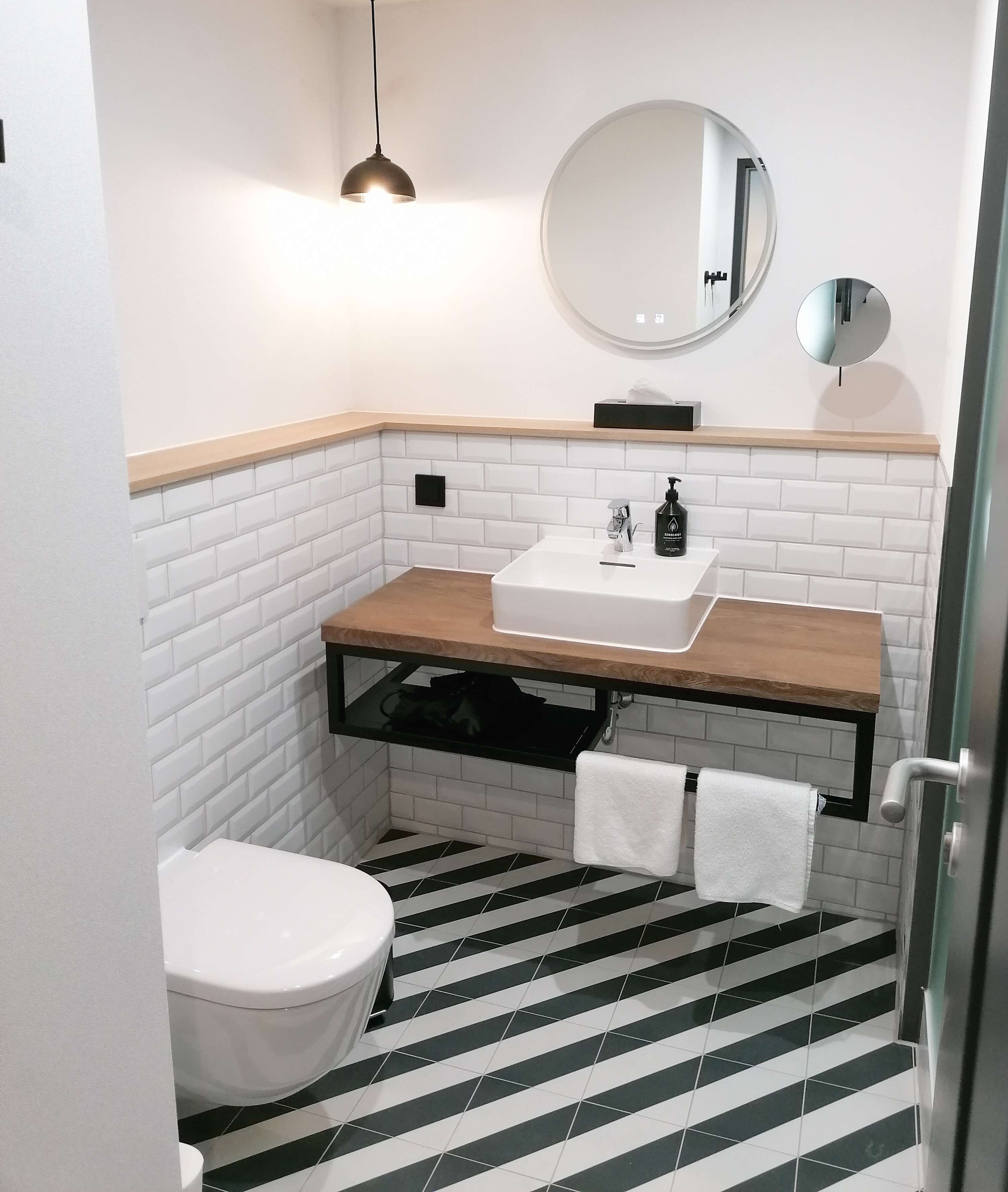 penta family apartment | bathroom | shower, rainfall showerhead, eco-friendly toiletries, hair dryer