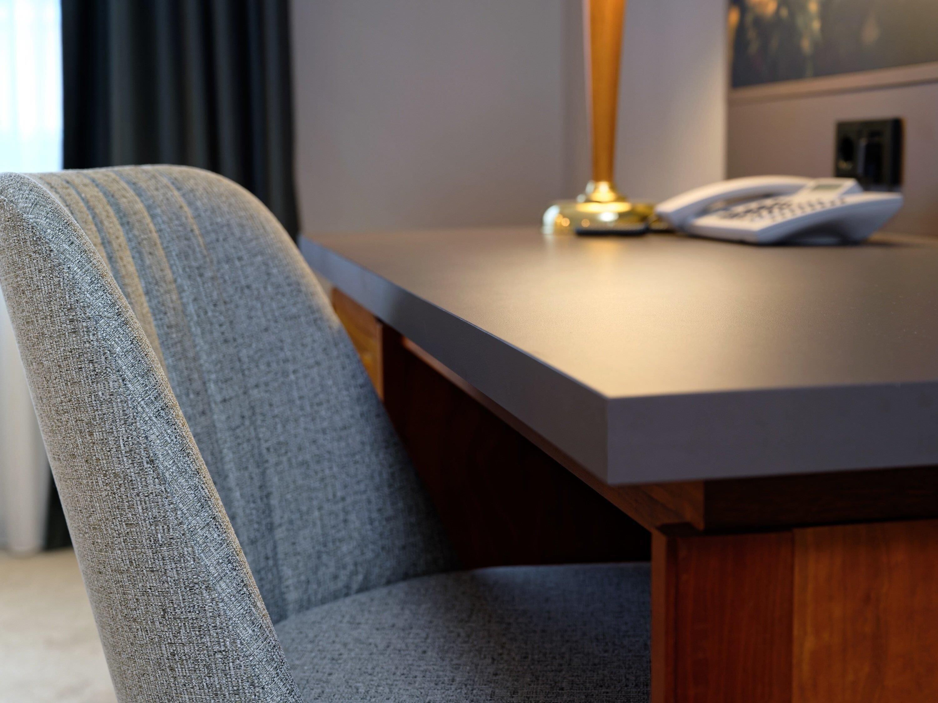 Hypo-allergenic bedding, desk, laptop workspace, blackout curtains