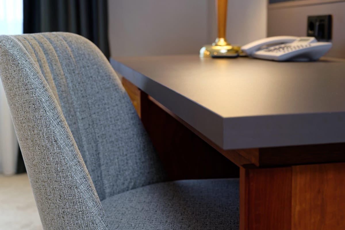 Hypo-allergenic bedding, desk, laptop workspace, blackout curtains