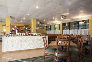 Enjoy meals in this inviting dining area with a central island and comfortable seating.