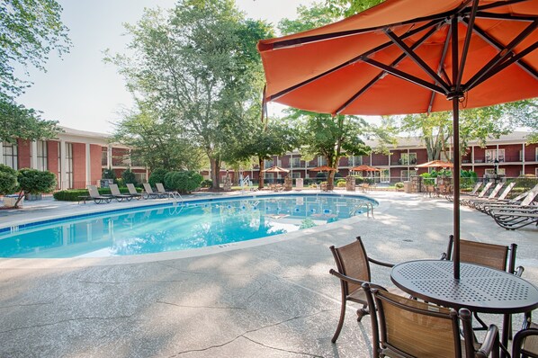 Seasonal outdoor pool, open 7:00 AM to 10:00 PM, pool umbrellas
