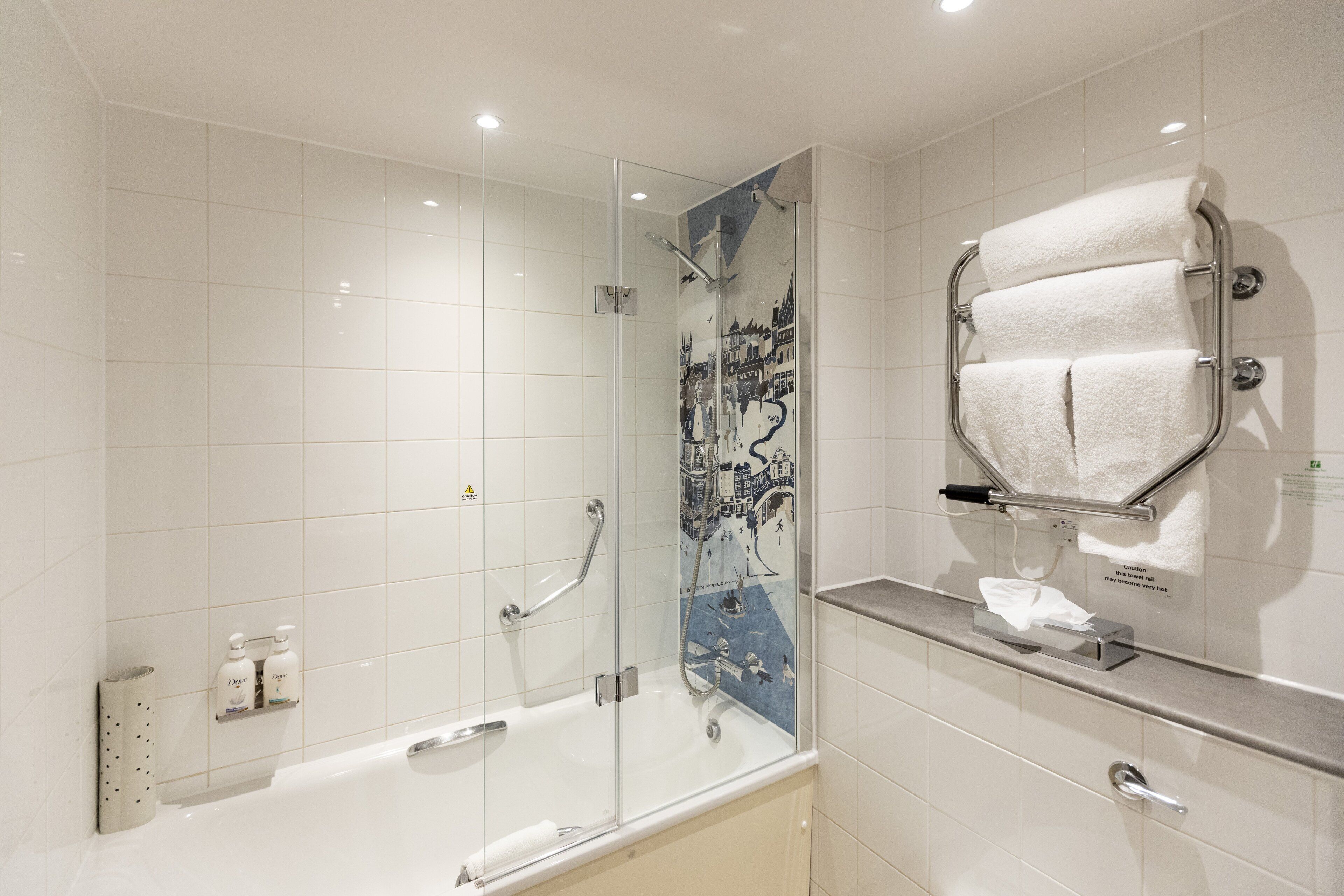 bathtub, free toiletries, hair dryer, towels