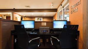 A workspace with two desks, each with a computer monitor, keyboard, and chair. - Fairfield Inn by Marriott Orangeburg (Orangeburg)