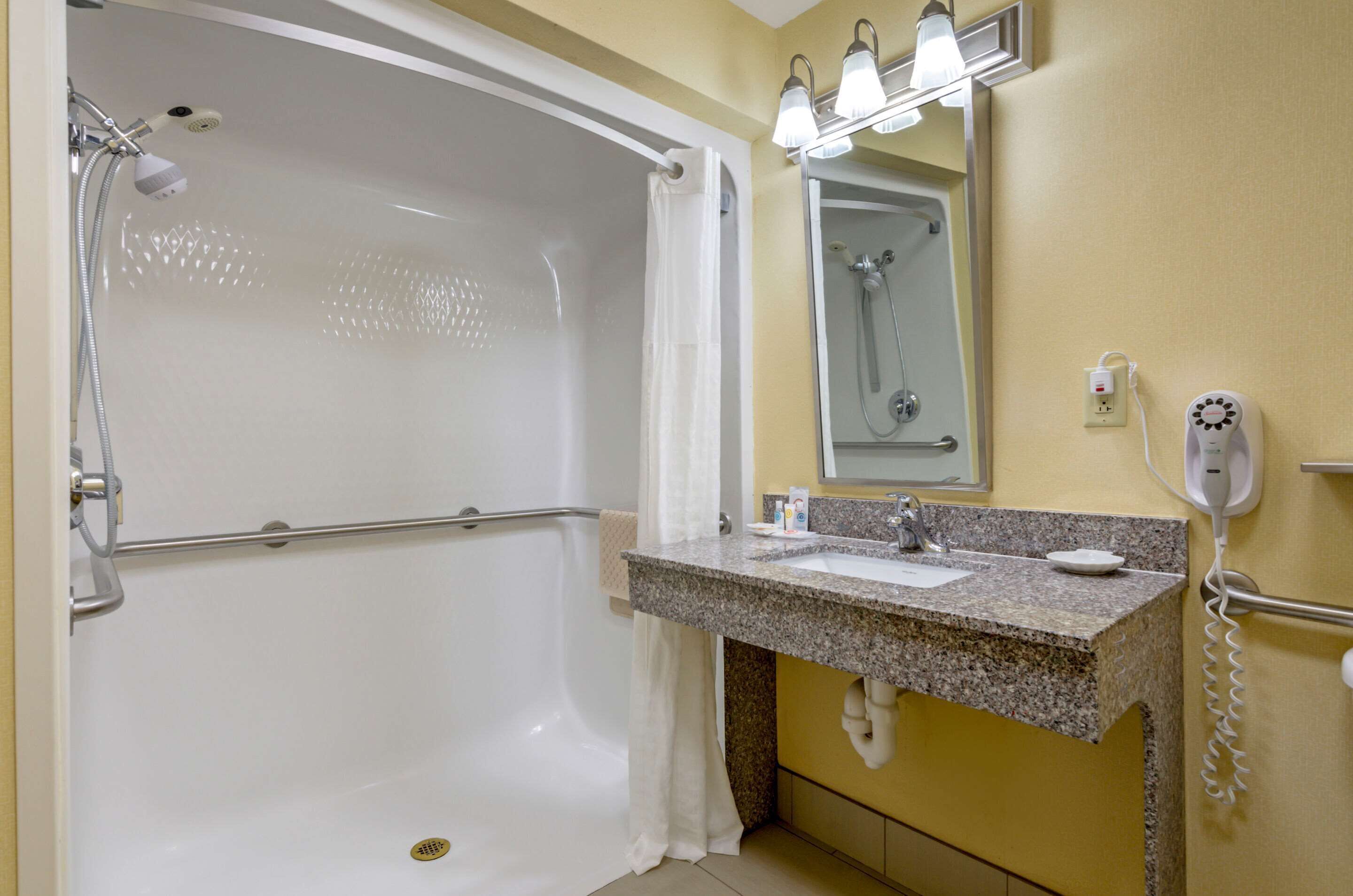 suite, 1 king bed, accessible, non smoking | bathroom | hair dryer, towels