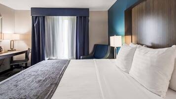 Desk, laptop workspace, blackout drapes, iron/ironing board