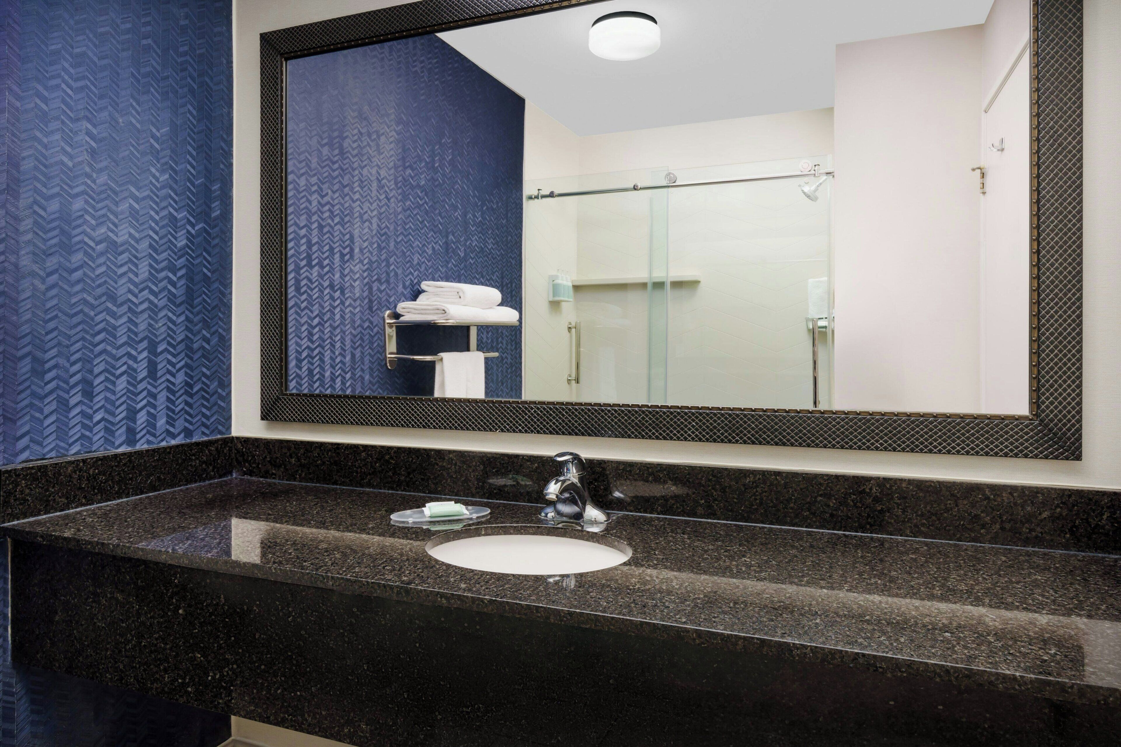 shower, free toiletries, hair dryer, towels