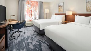 A hotel room with two beds, a desk with a computer, a chair, and a TV. - Fairfield Inn by Marriott Raleigh Airport/RTP (Morrisville)