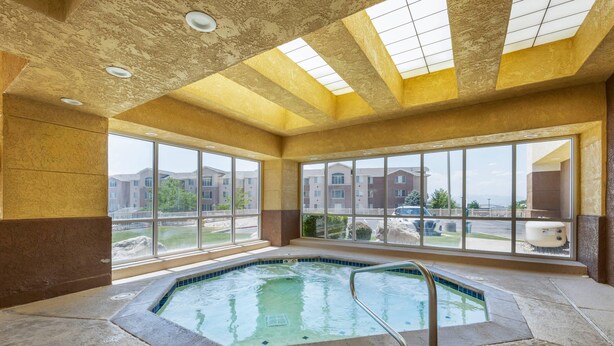 A large indoor swimming pool with a clear view of the outside through large windows. - Comfort Inn & Suites Orem - Provo (Orem)