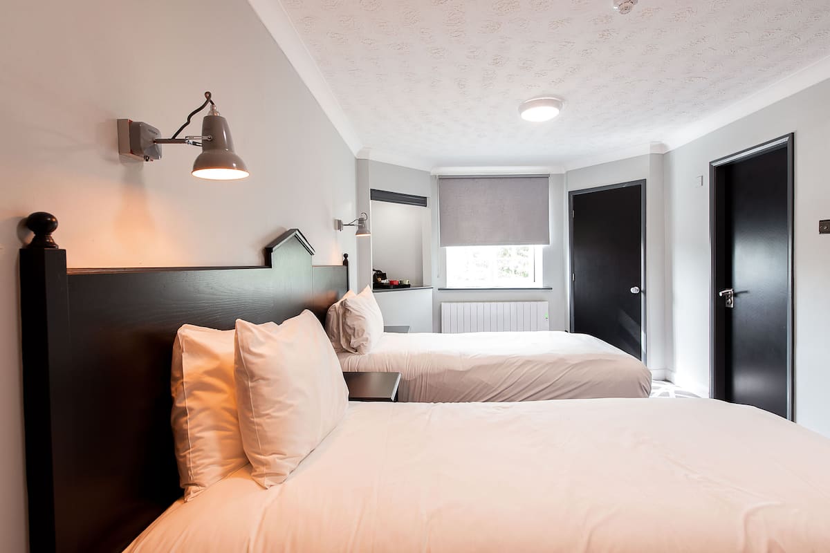 twin room, 2 single beds | 1 bedroom, desk, laptop workspace, blackout curtains