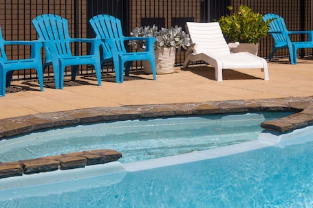 Outdoor pool, open 10:00 AM to 8:00 PM, pool loungers. Comfort Inn Glenelg