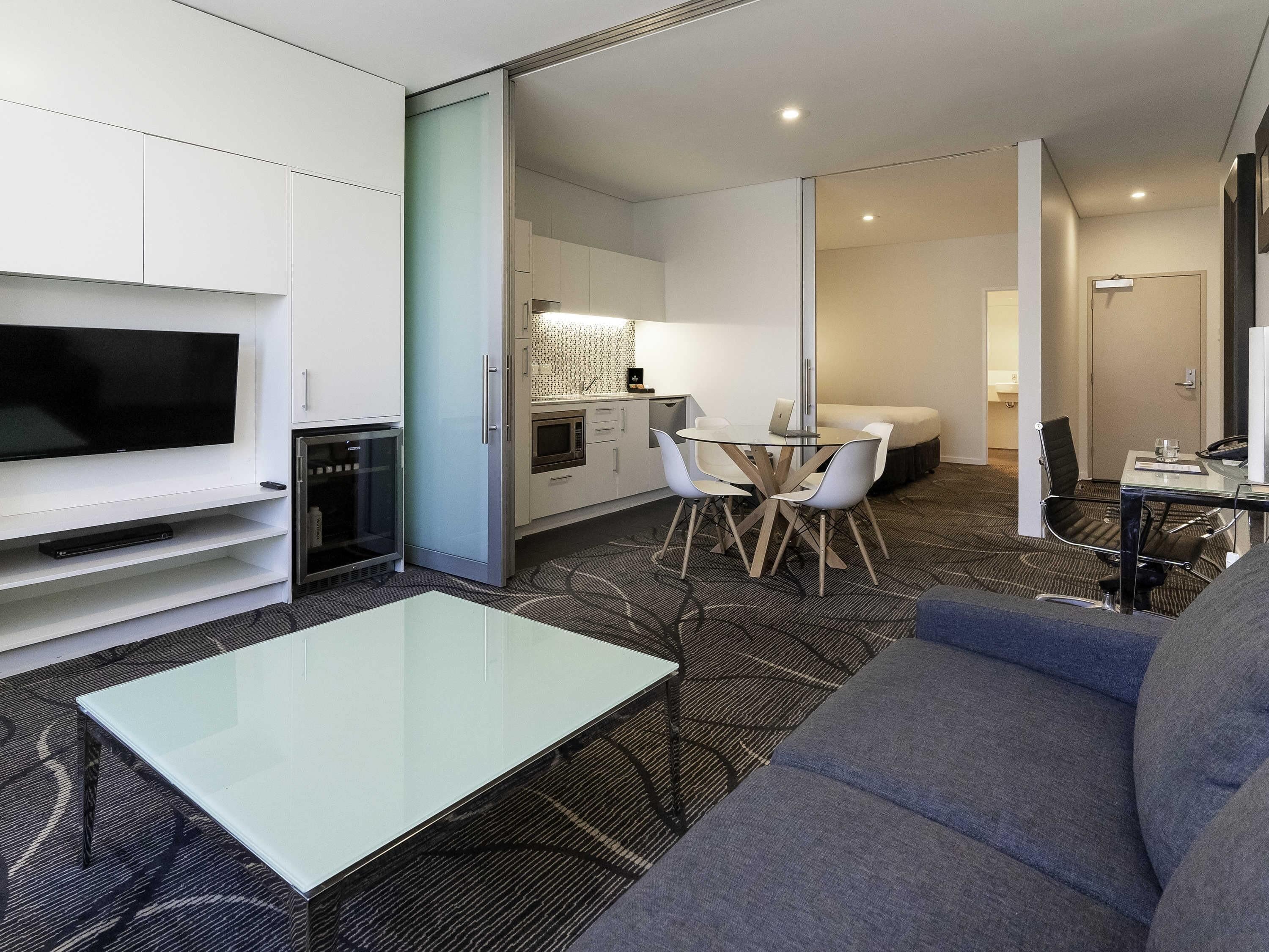 premium bedding, desk, blackout curtains, iron/ironing board