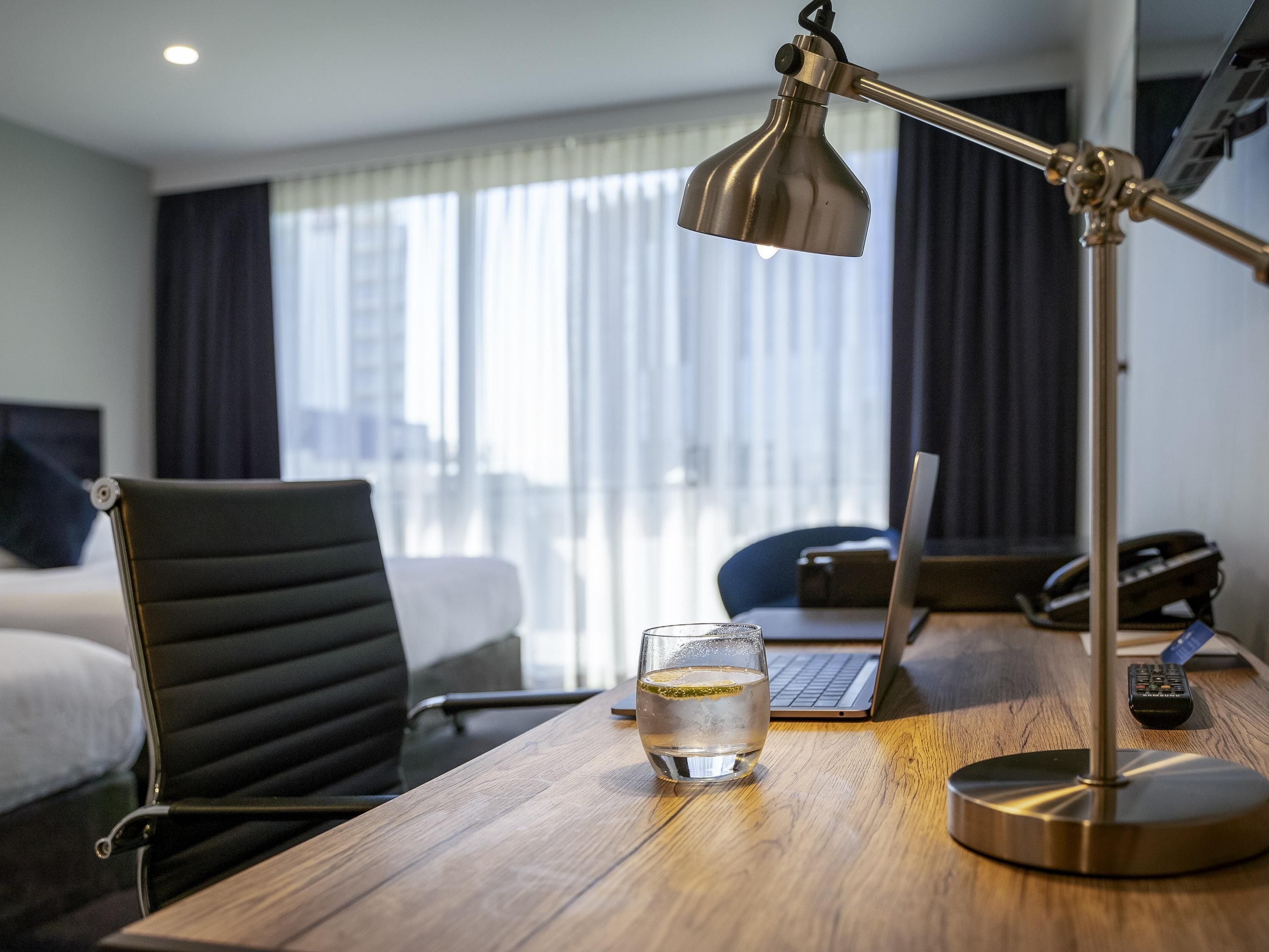 premium bedding, desk, blackout curtains, iron/ironing board