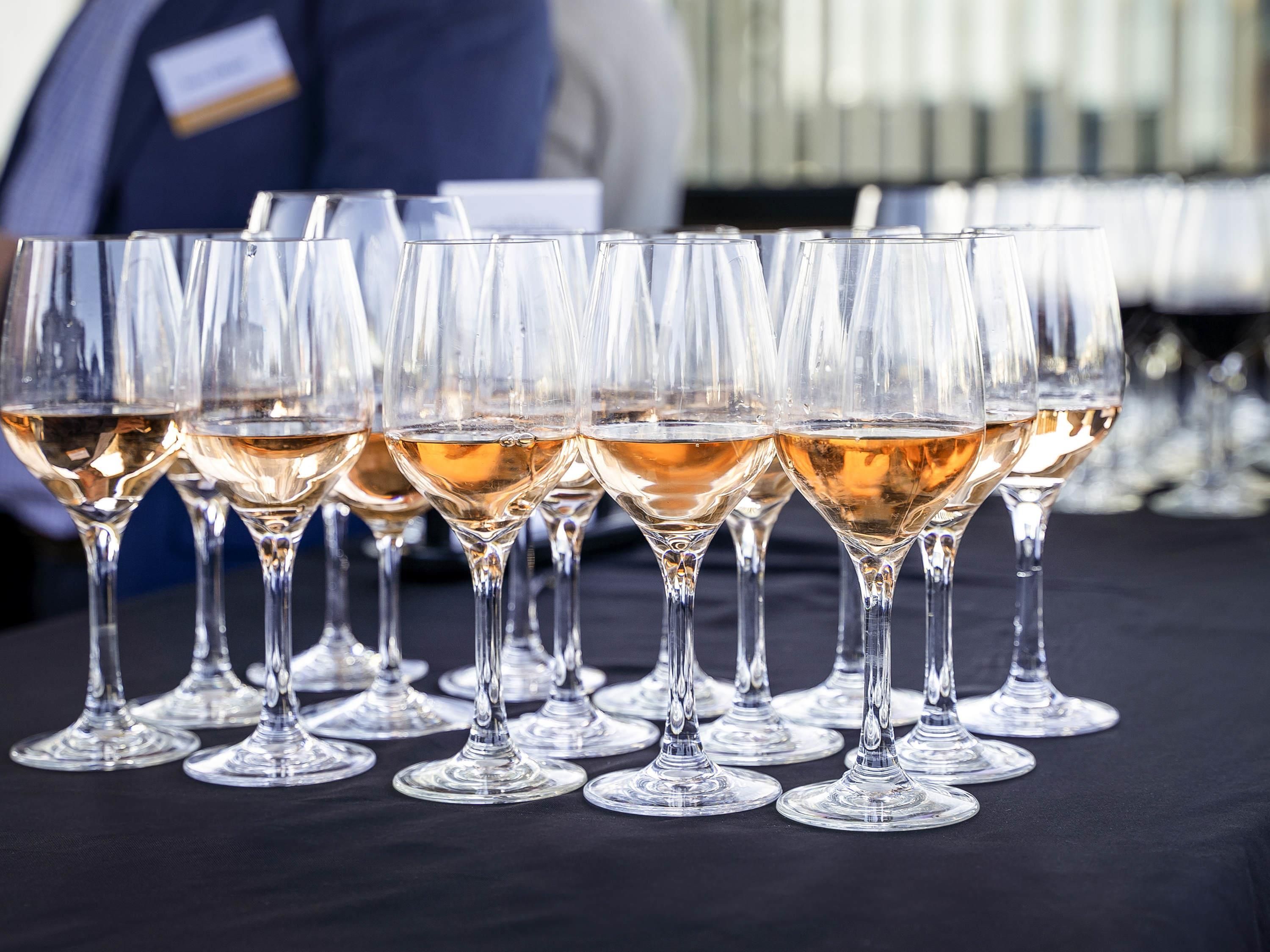 A row of champagne flutes on a table.