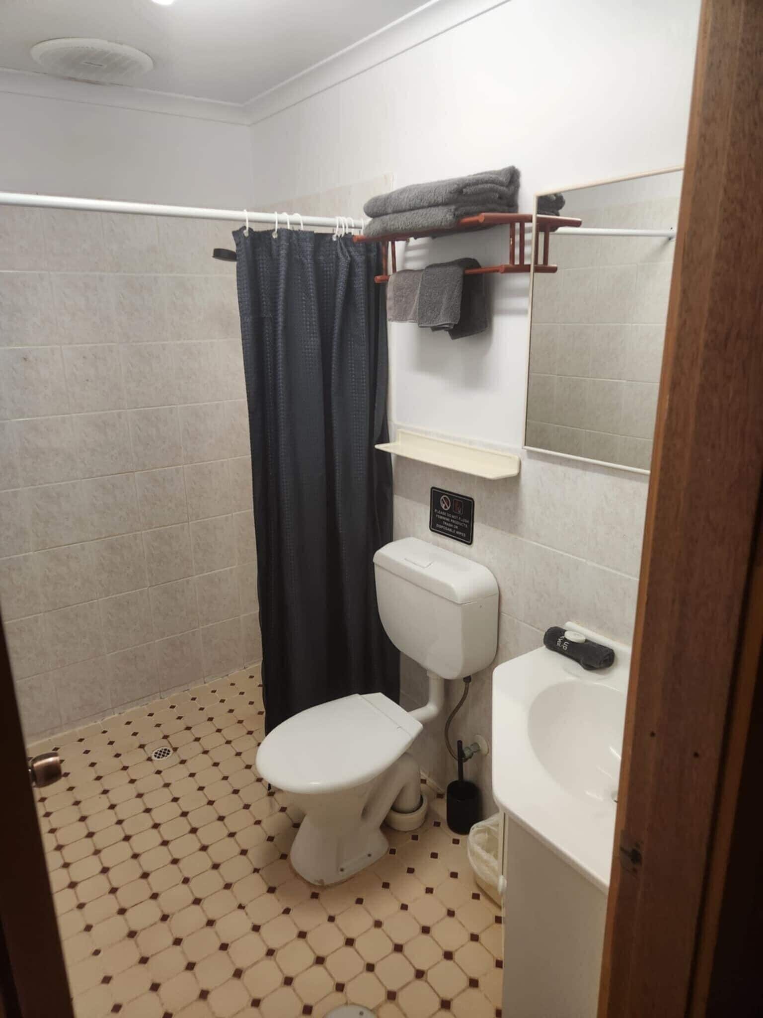 standard quadruple room | bathroom | shower, hair dryer, towels