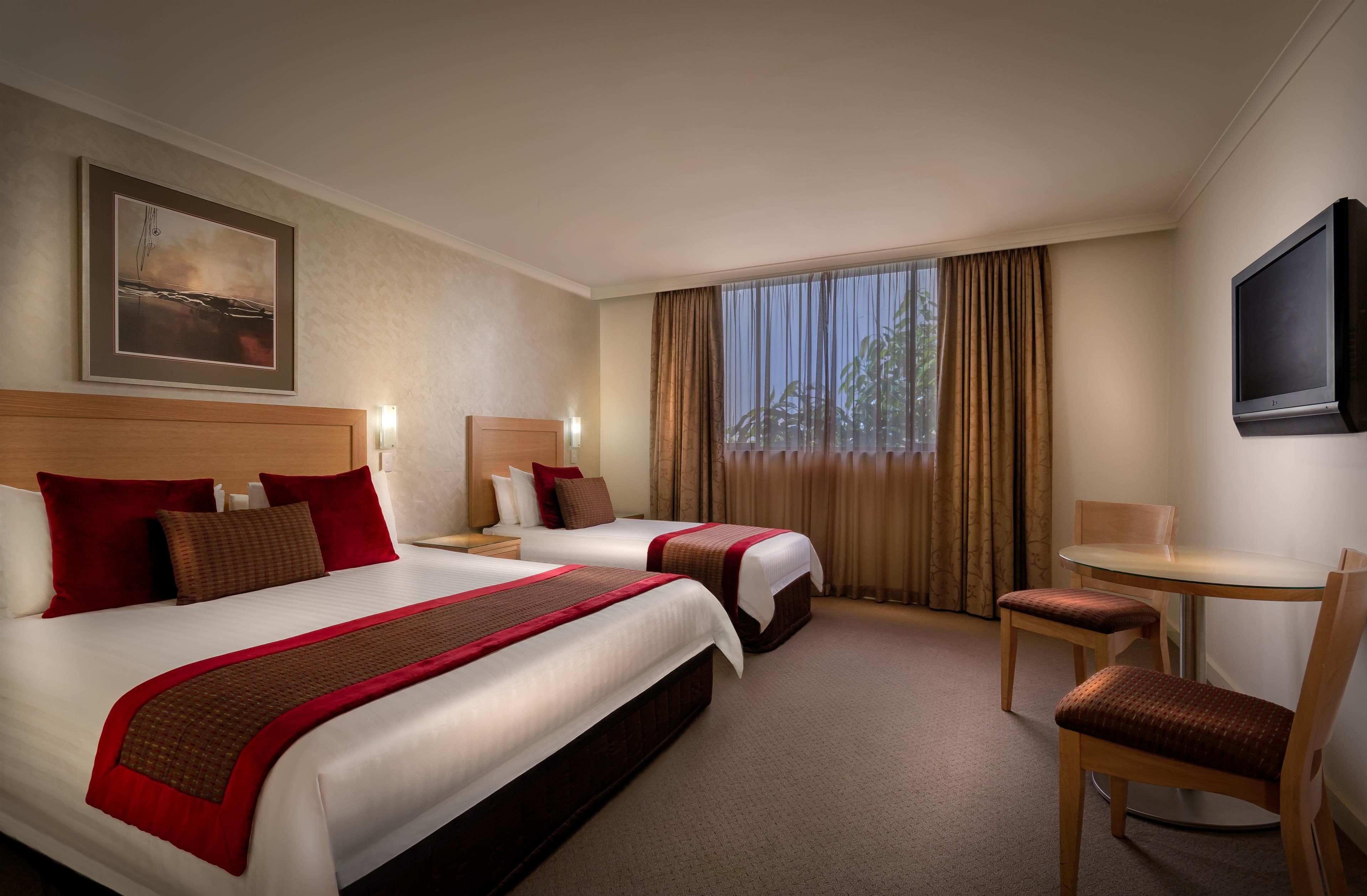 deluxe room, multiple beds, non smoking (walk-in shower) | premium bedding, in-room safe, desk, laptop workspace