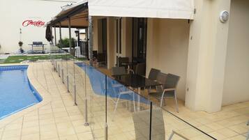 Outdoor pool, pool umbrellas, pool loungers