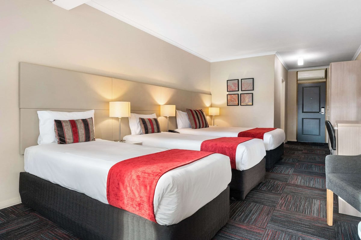 Family Room | Premium bedding, desk, blackout drapes, iron/ironing board