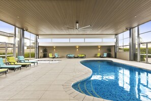 Indoor pool, open 7:00 AM to 9:30 PM, pool loungers