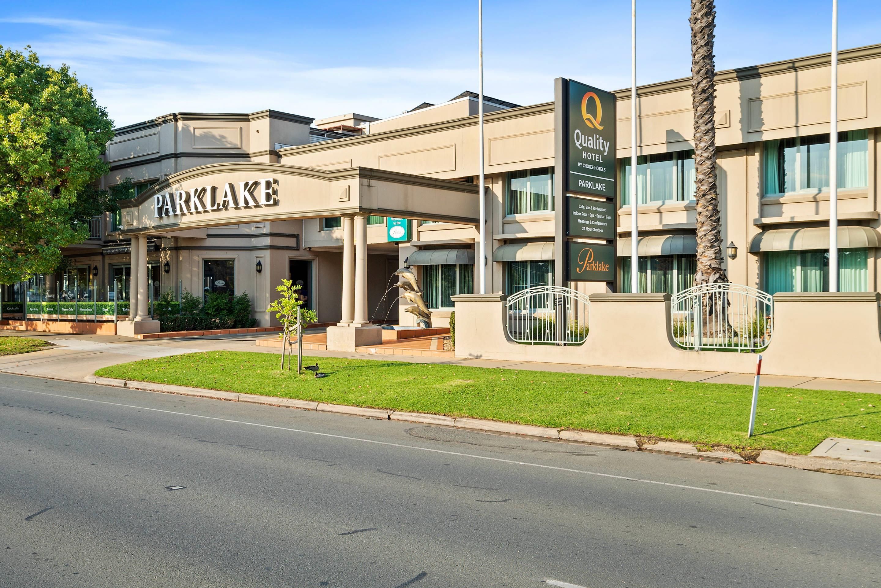 A hotel with a prominent sign reading 'Parklake.'