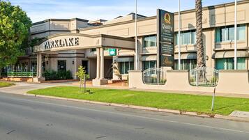 A hotel with a prominent sign reading 'Parklake.'
