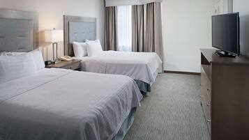 Premium bedding, desk, laptop workspace, blackout drapes