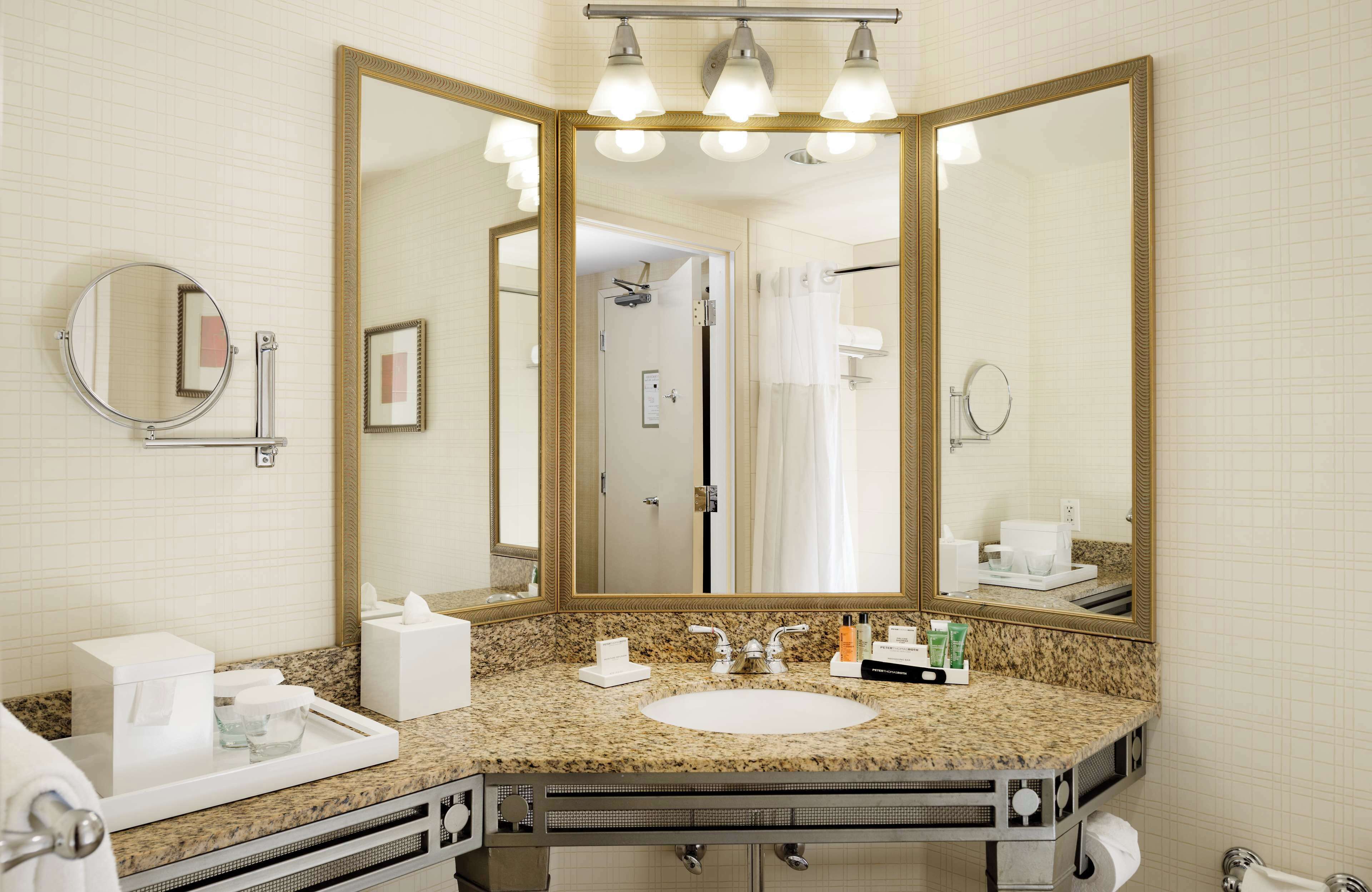 combined shower/bathtub, designer toiletries, hair dryer, towels