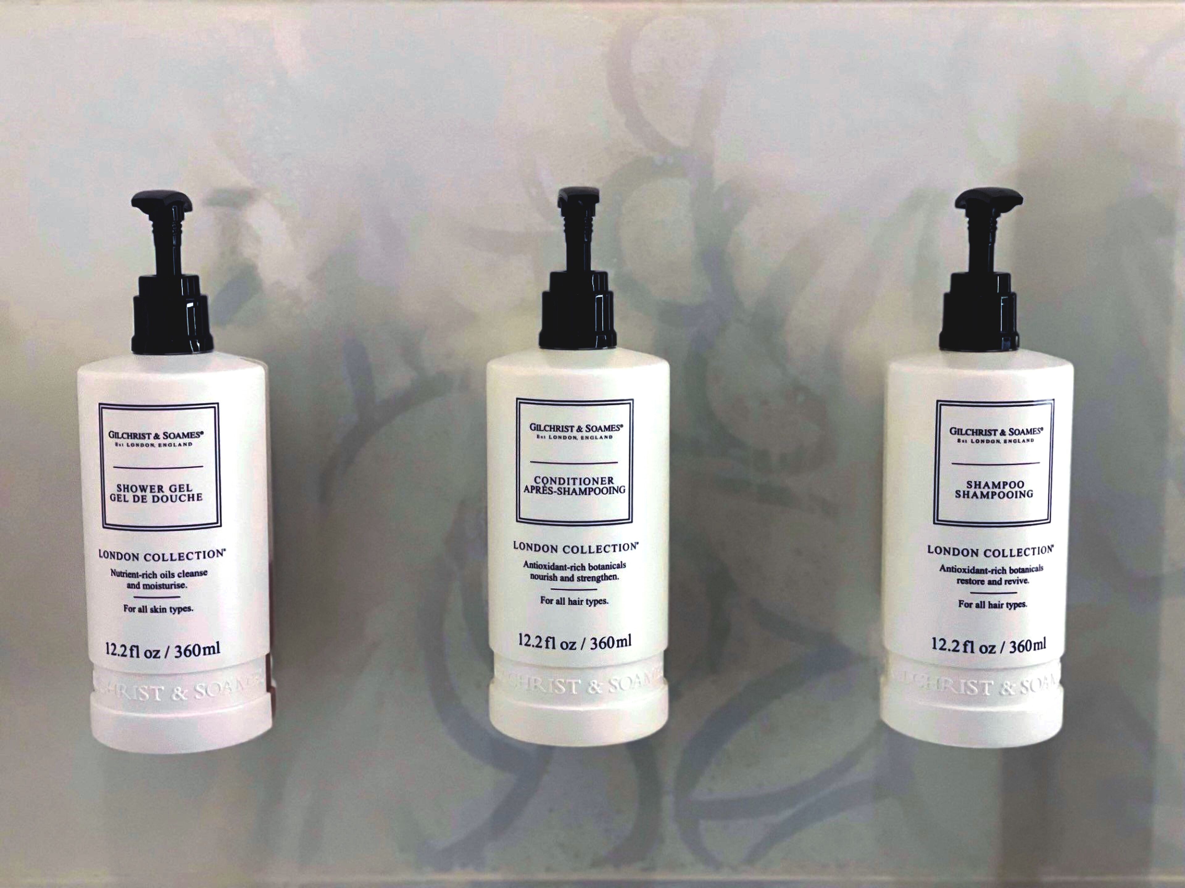 combined shower/bathtub, designer toiletries, hair dryer, towels