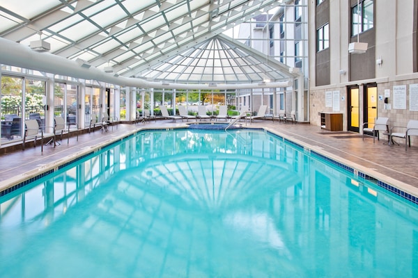 Indoor pool, open 9 AM to 10 PM, pool umbrellas, sun loungers