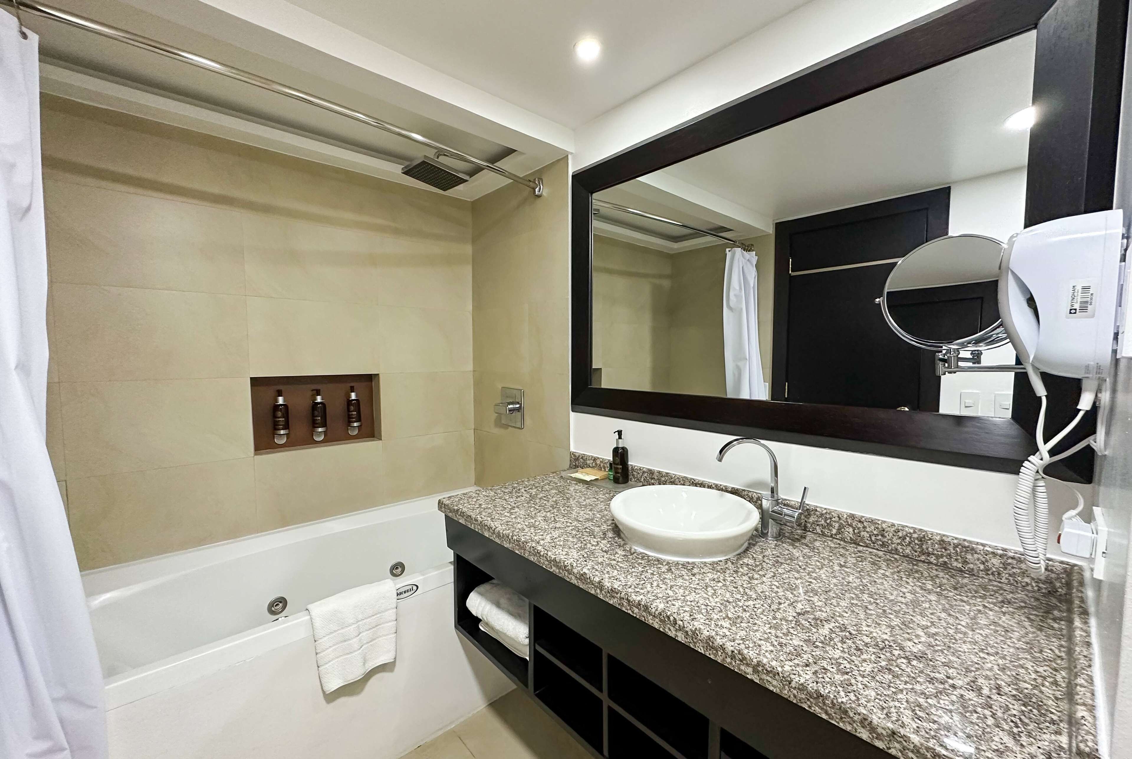 junior suite, 1 king bed (premium) | bathroom | shower, free toiletries, hair dryer, towels