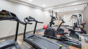 A gym with treadmills, elliptical machines, and exercise balls. - Baymont Inn & Suites Grand Rapids Near Downtown (Grand Rapids)