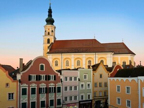 A historic building with a prominent tower and a clock.