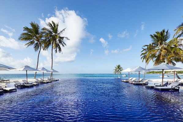 3 outdoor pools, open 9:00 AM to 6:00 PM, pool umbrellas, pool loungers