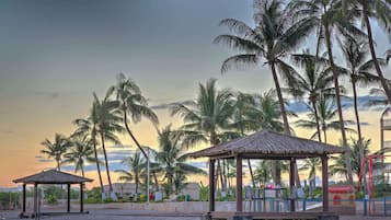 On the beach, white sand, beach umbrellas, beach towels