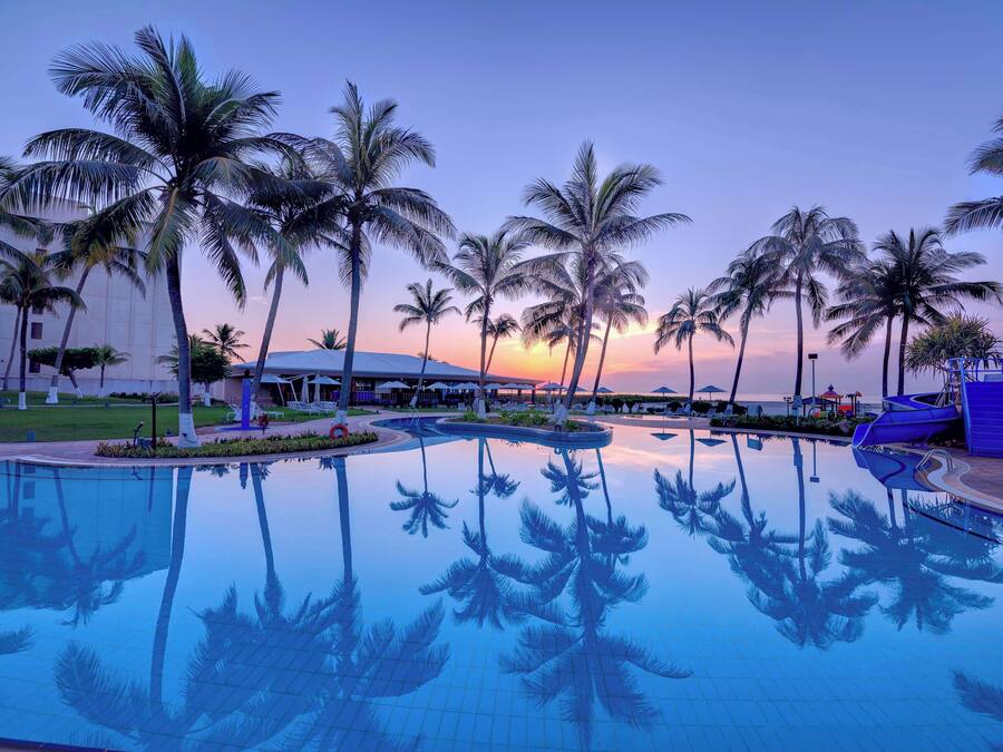 Outdoor pool, open 8:00 AM to 8:00 PM, pool umbrellas, sun loungers