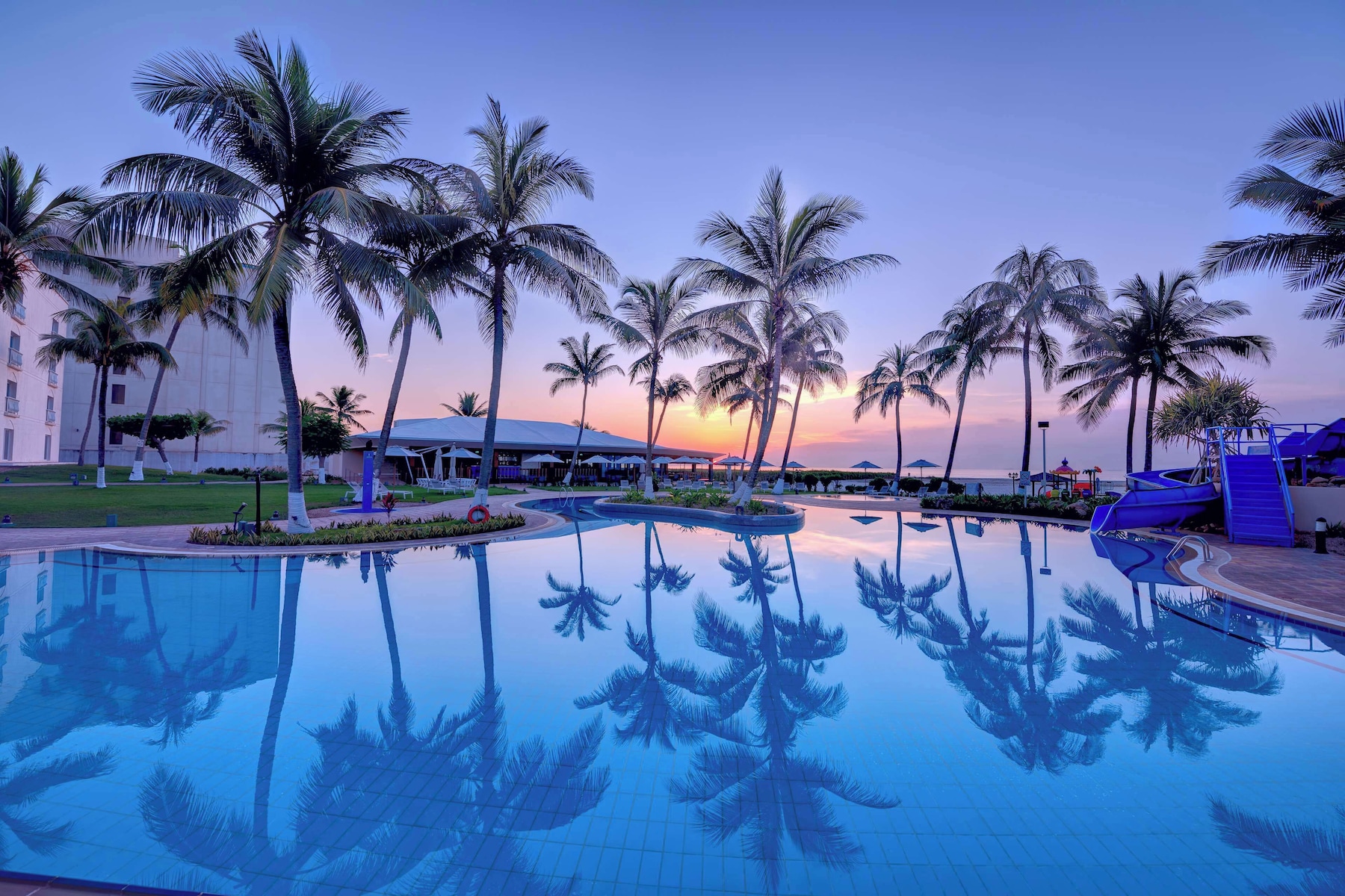 Outdoor pool, open 8:00 AM to 8:00 PM, pool umbrellas, pool loungers