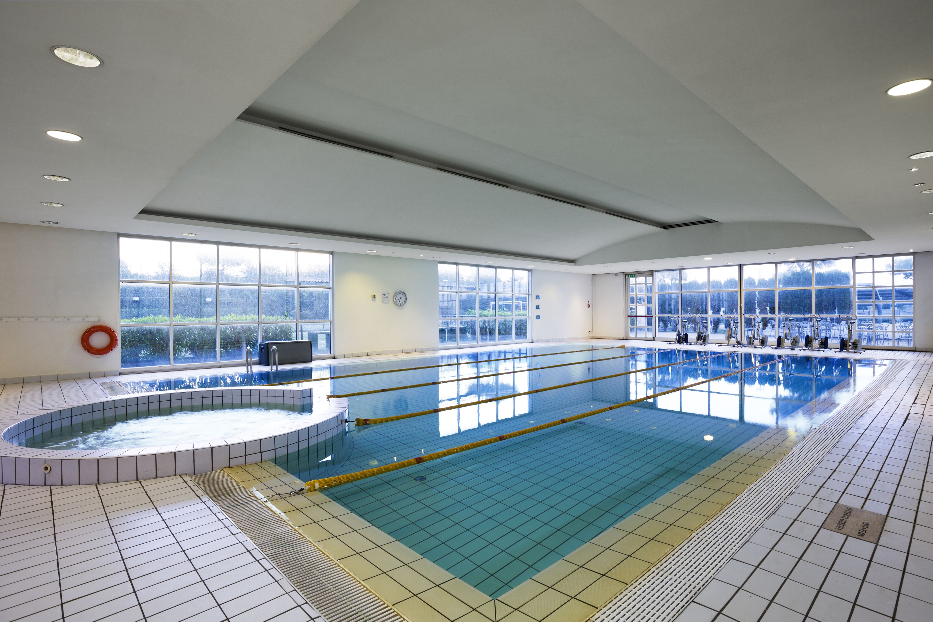 indoor pool, open 7:00 am to 10:00 pm, pool umbrellas, pool loungers