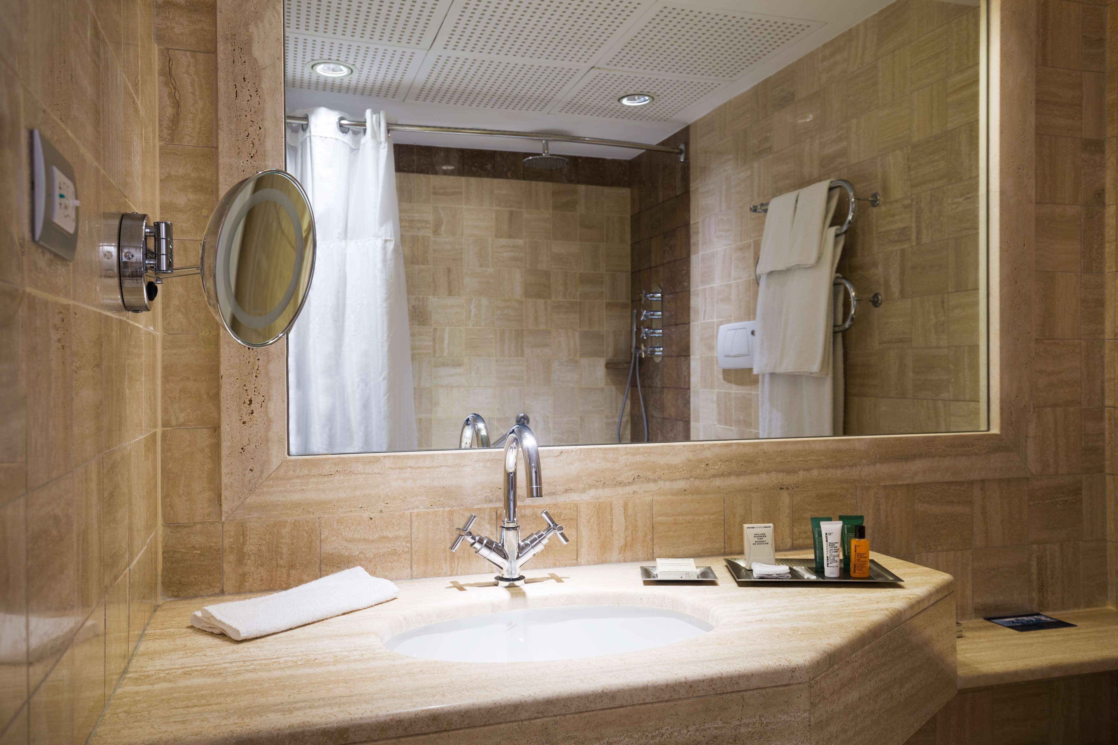 combined shower/bathtub, eco-friendly toiletries, hair dryer, bathrobes