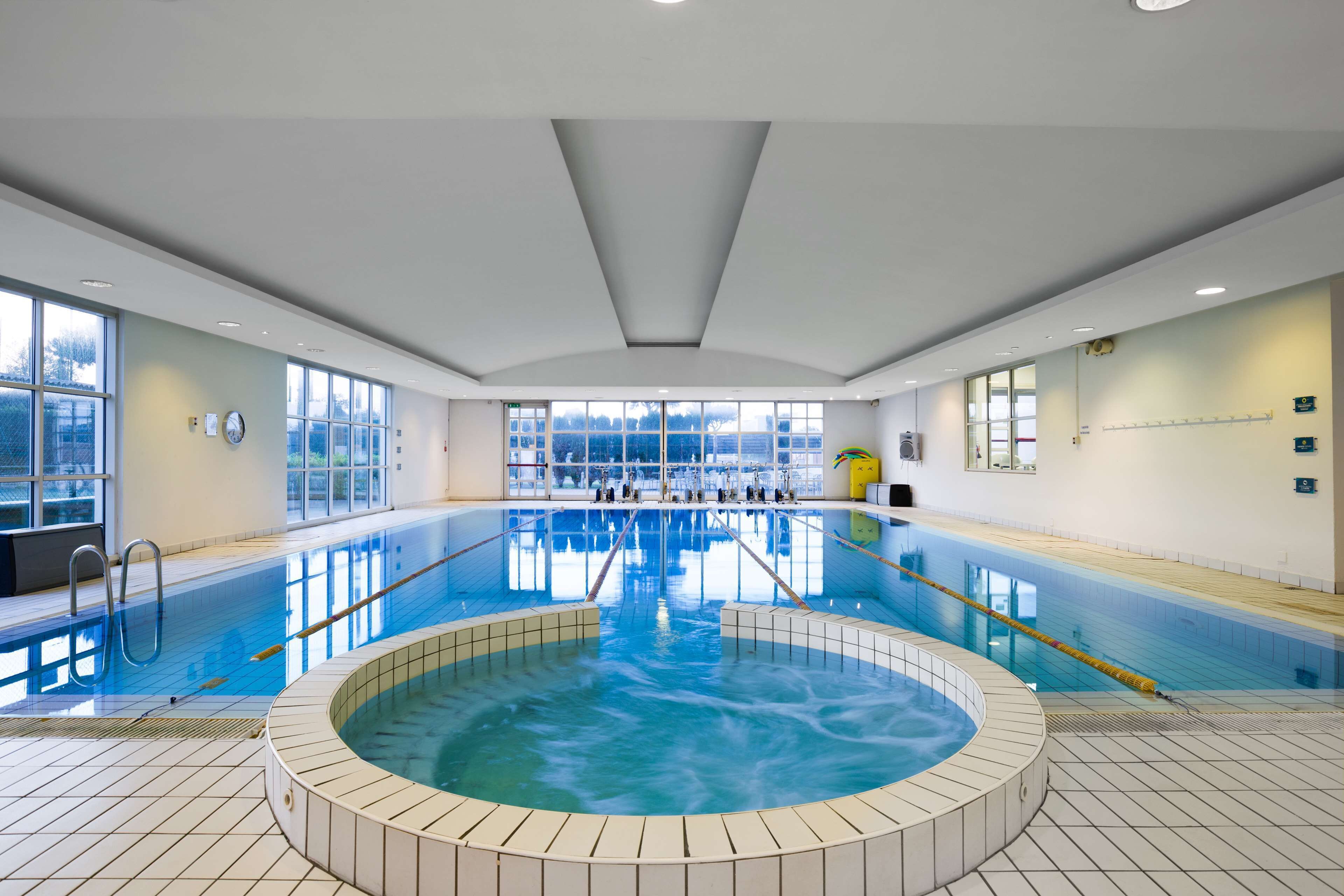 Indoor pool, open 7:00 AM to 10:00 PM, pool umbrellas, pool loungers