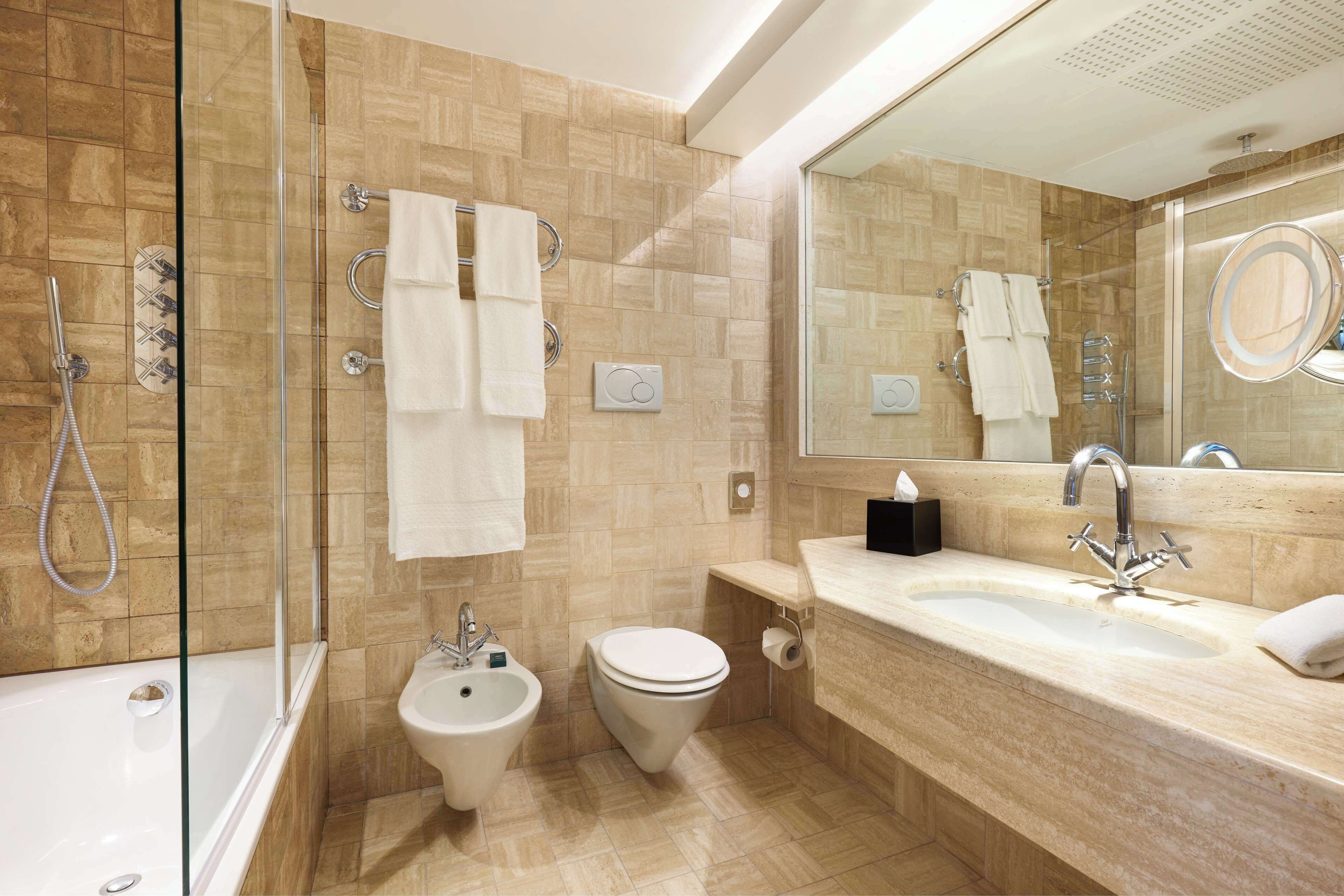 combined shower/bathtub, eco-friendly toiletries, hair dryer, bathrobes