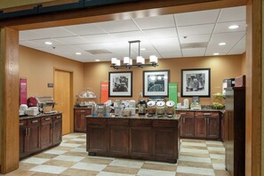 Enjoy a well-organized space with a central island, breakfast essentials, and ample storage.