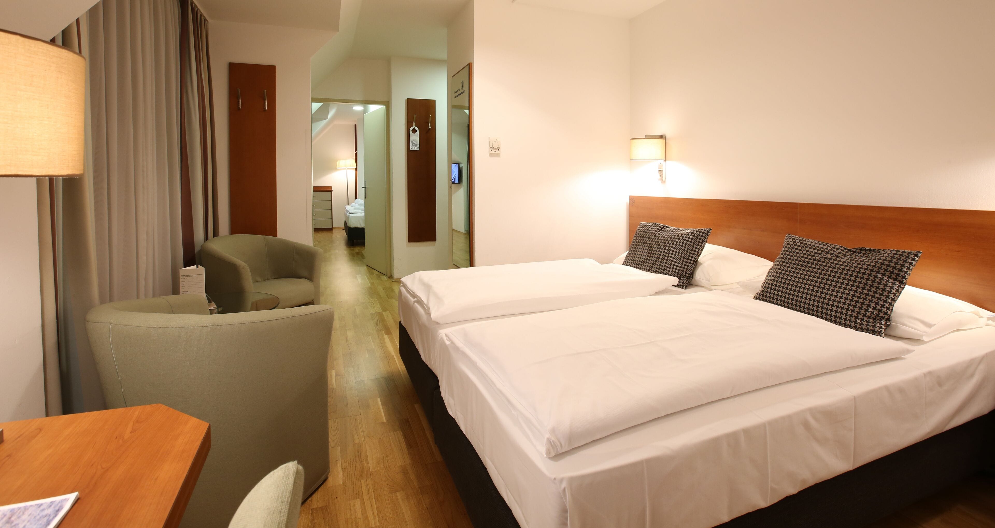 family room | premium bedding, minibar, in-room safe, desk